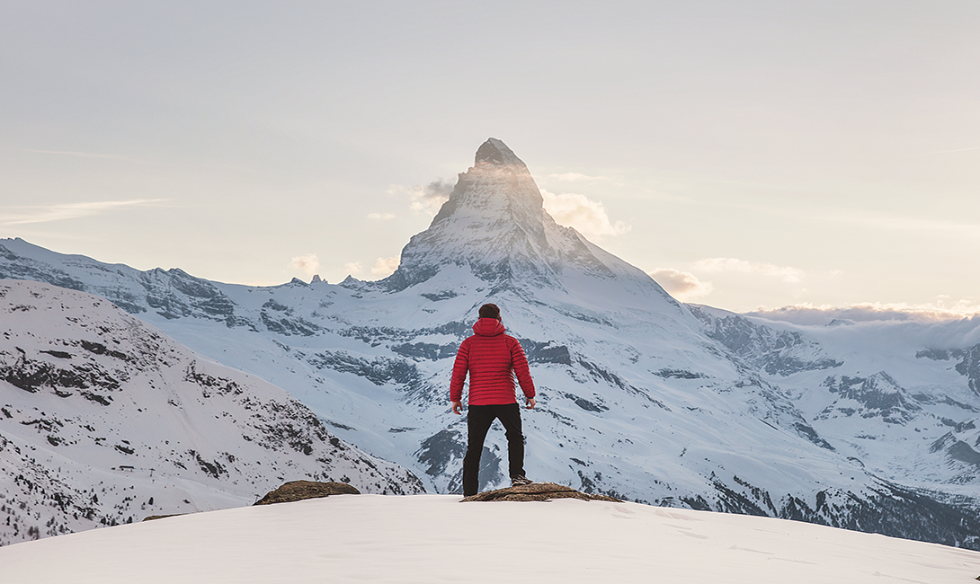 mountain climber overlooking mountain peak referencing Sharepoint successful intranet