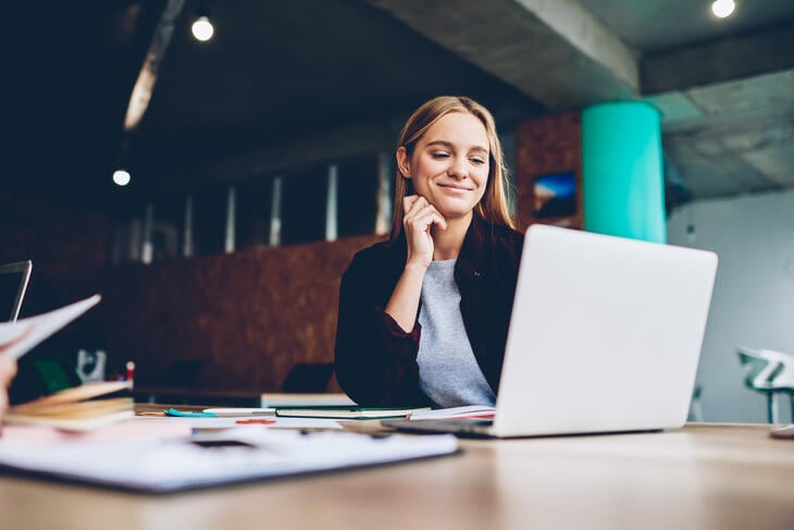 Woman at laptop working on communication plan